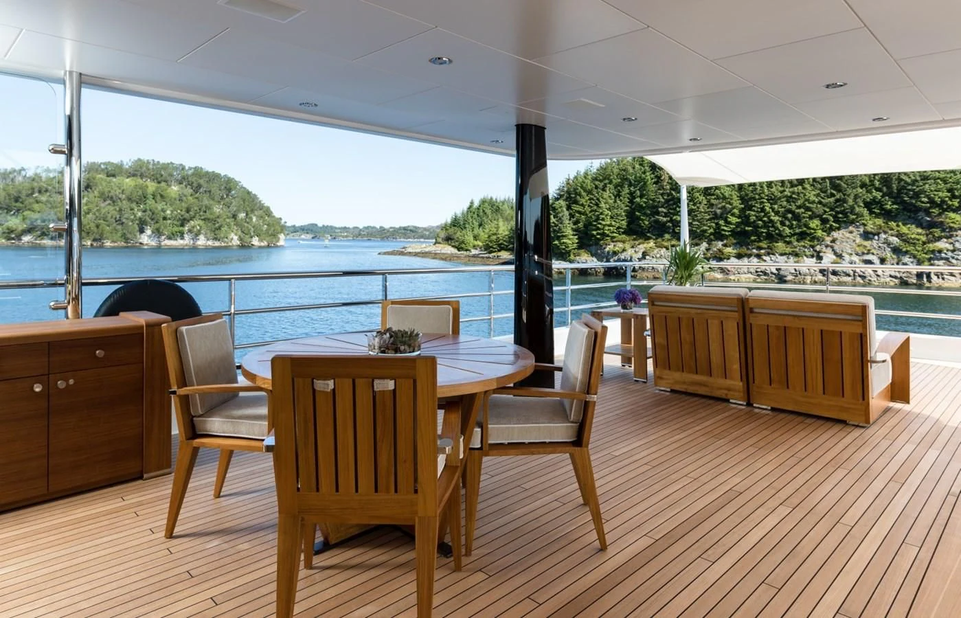a room with a table and chairs aboard AMIGOS Yacht for Charter