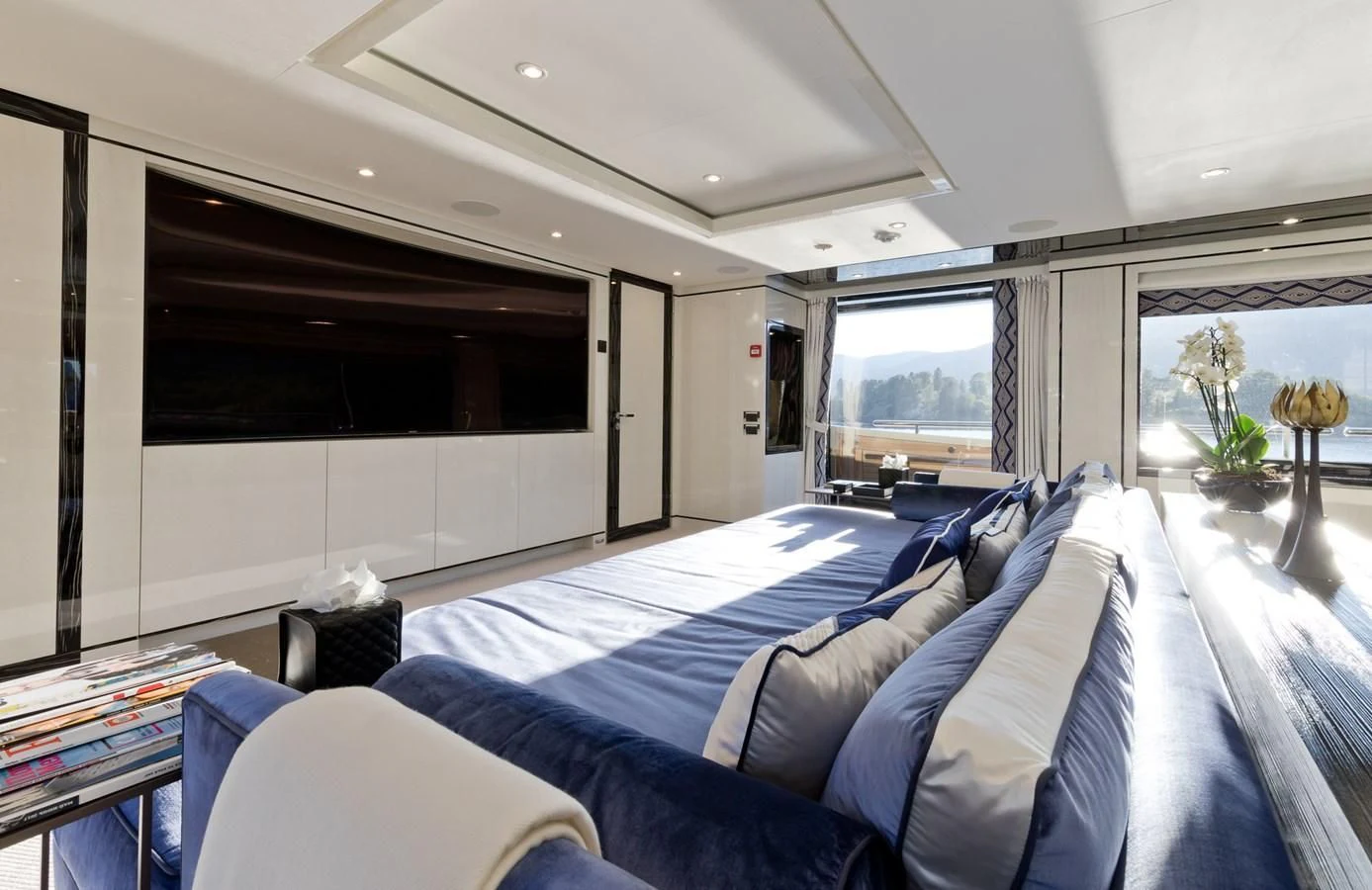 a bedroom with a large bed aboard AMIGOS Yacht for Charter