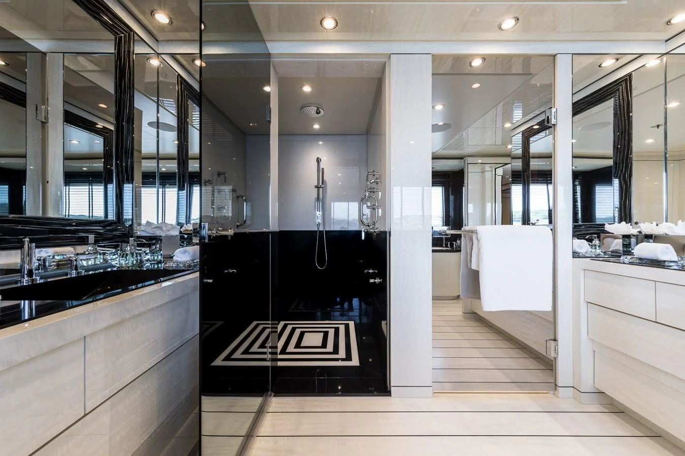 a bathroom with a large mirror aboard AMIGOS Yacht for Charter