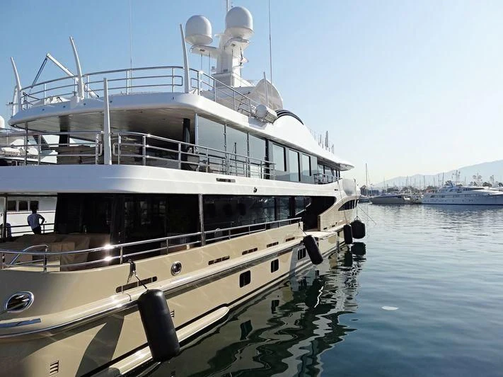 a large white boat with a propeller aboard AMIGOS Yacht for Charter