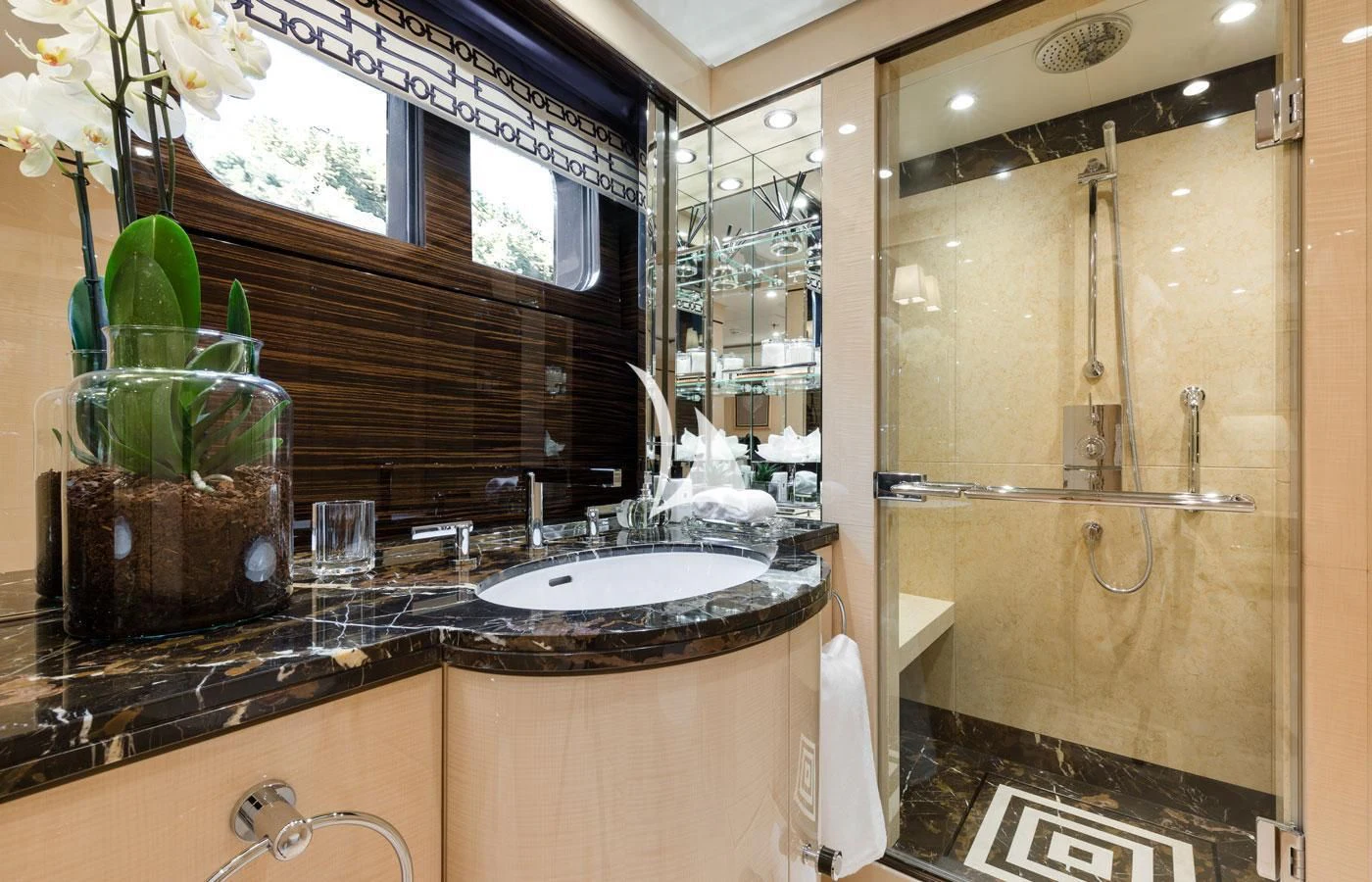a bathroom with a sink and a mirror aboard AMIGOS Yacht for Charter