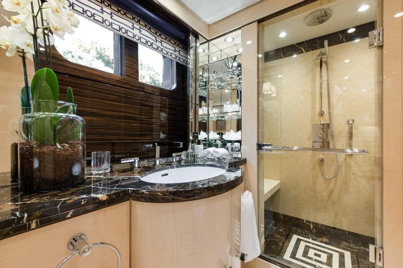 a bathroom with a large mirror aboard AMIGOS Yacht for Charter
