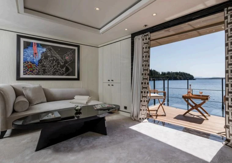 a living room with a large window aboard AMIGOS Yacht for Charter