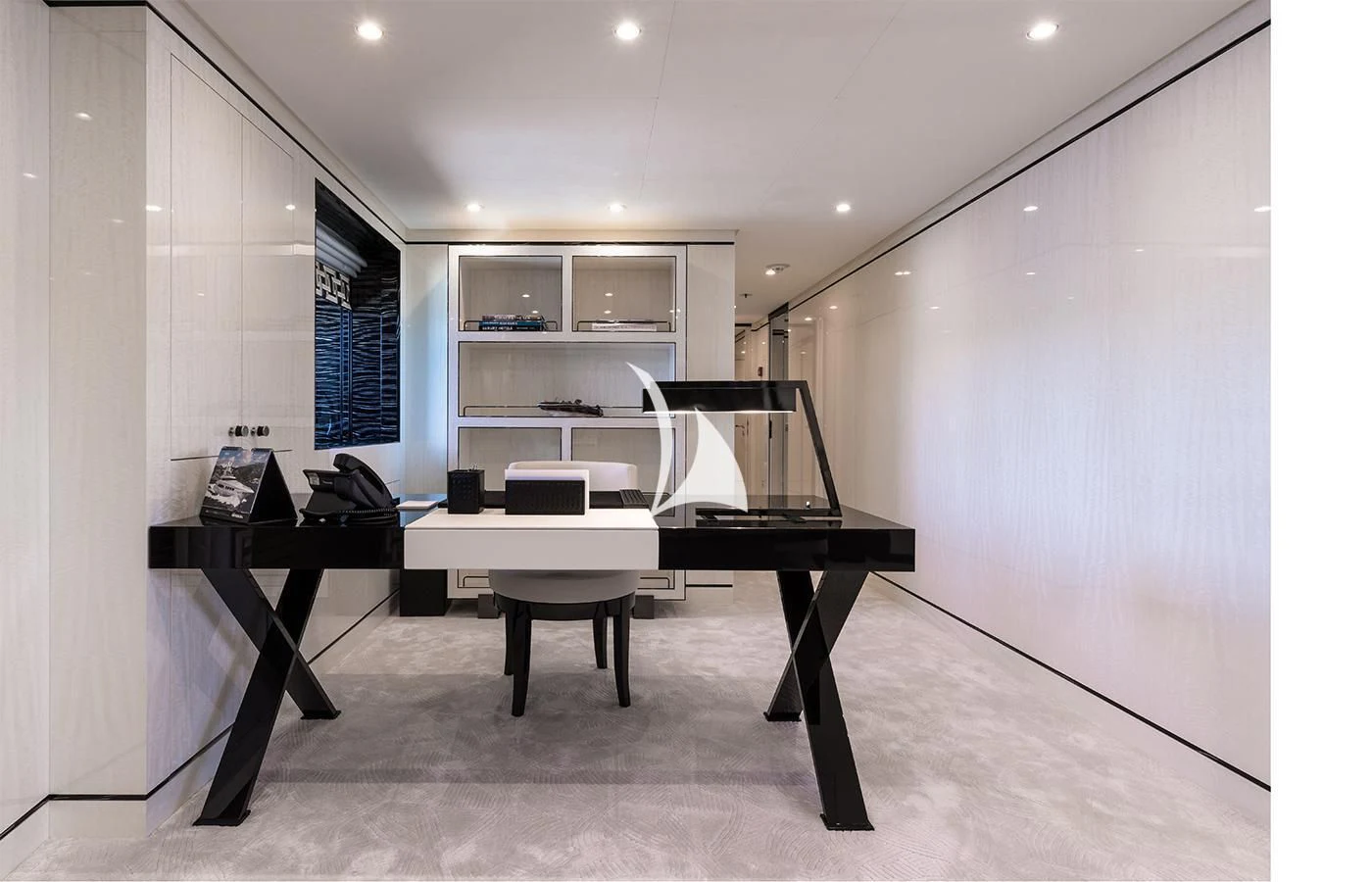 a room with a piano and a shelf with objects on it aboard AMIGOS Yacht for Charter