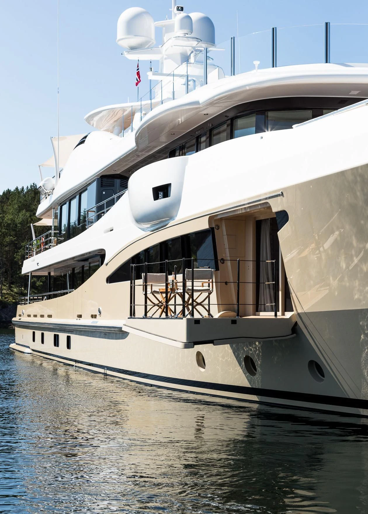 a large white boat with a door aboard AMIGOS Yacht for Charter