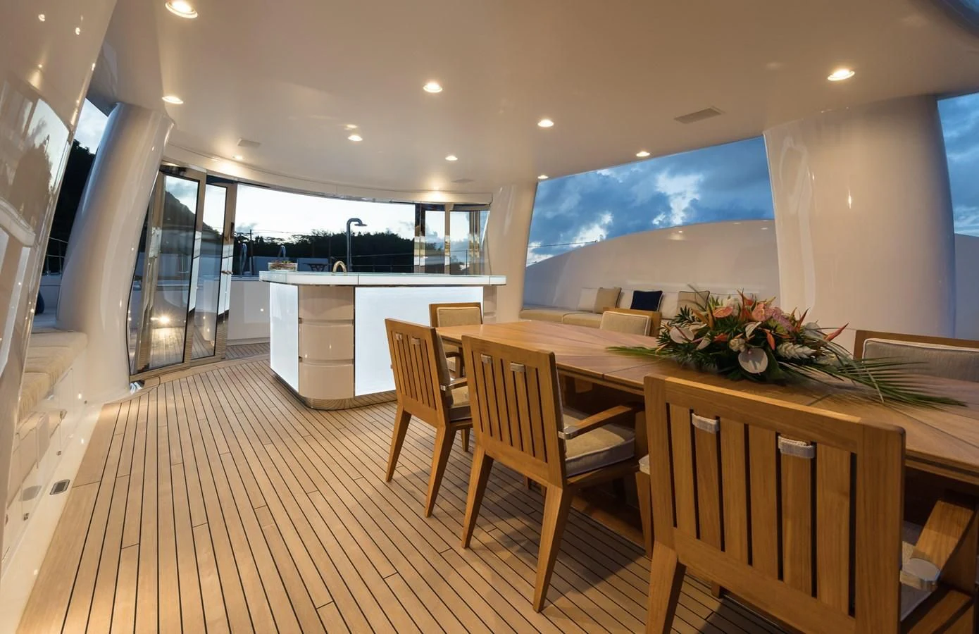 a kitchen with a table and chairs aboard AMIGOS Yacht for Charter