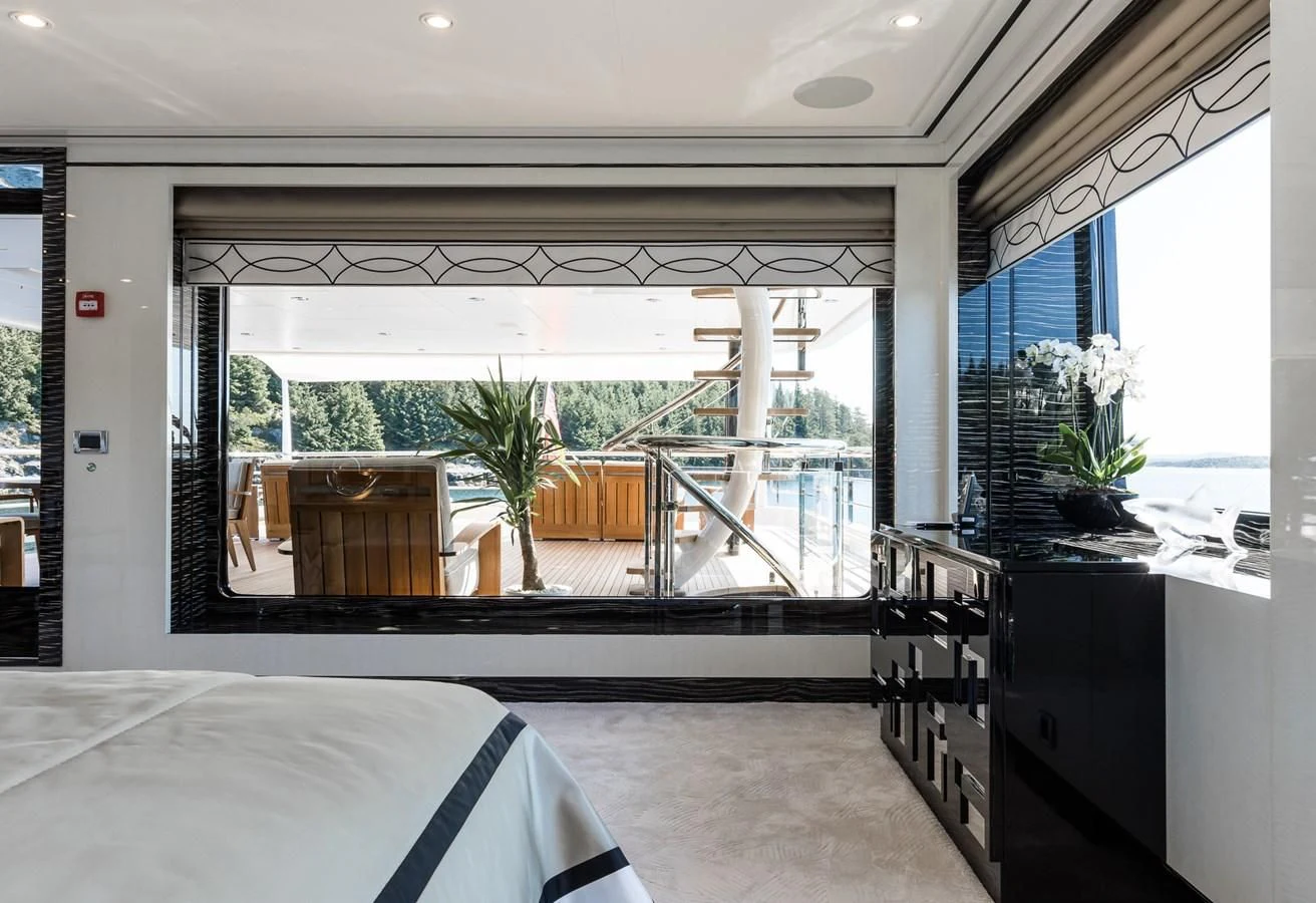 a room with a table and chairs aboard AMIGOS Yacht for Charter