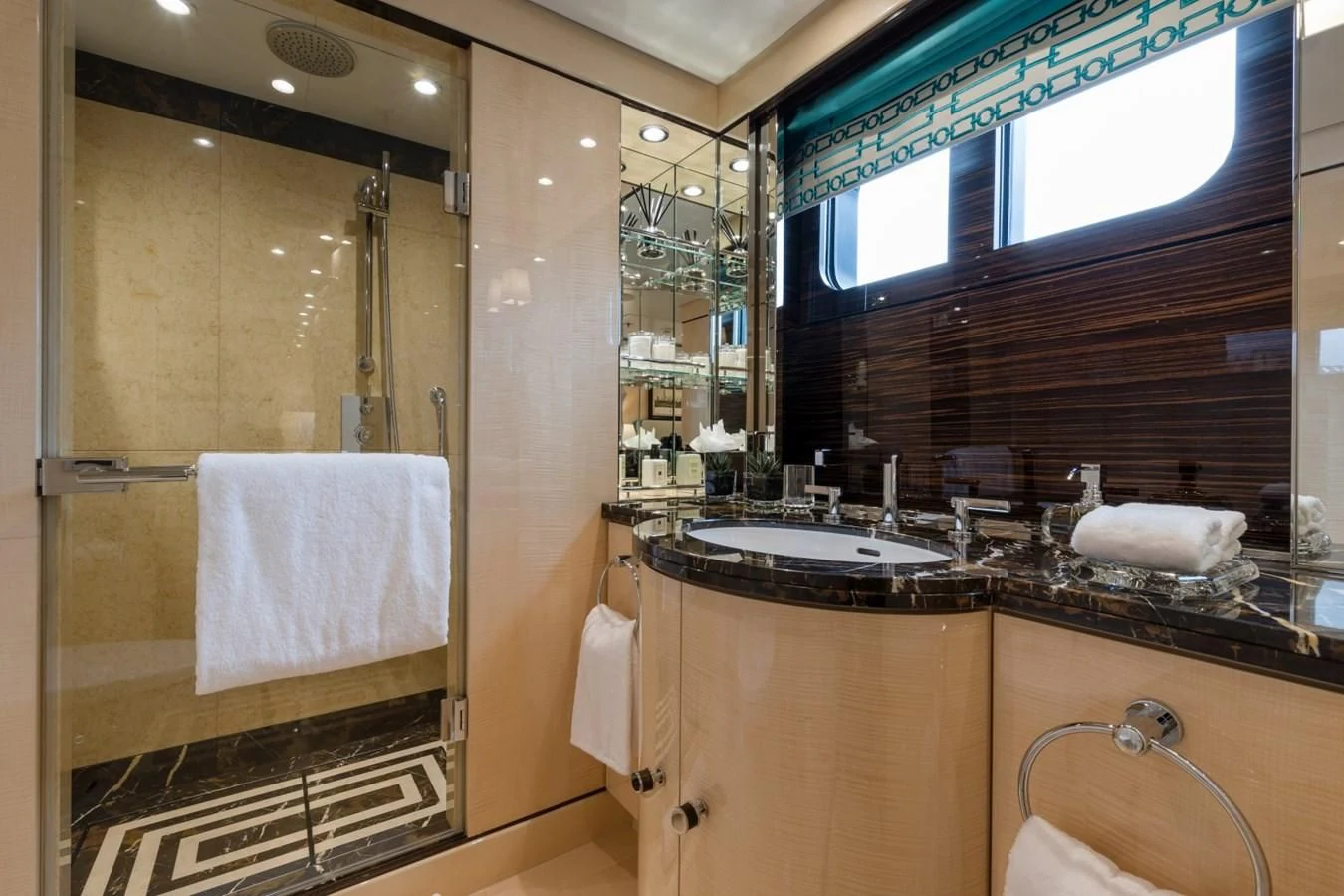 a bathroom with a sink and a mirror aboard AMIGOS Yacht for Charter
