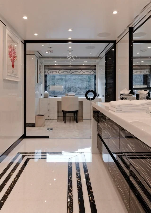 a large bathroom with a large mirror aboard AMIGOS Yacht for Charter