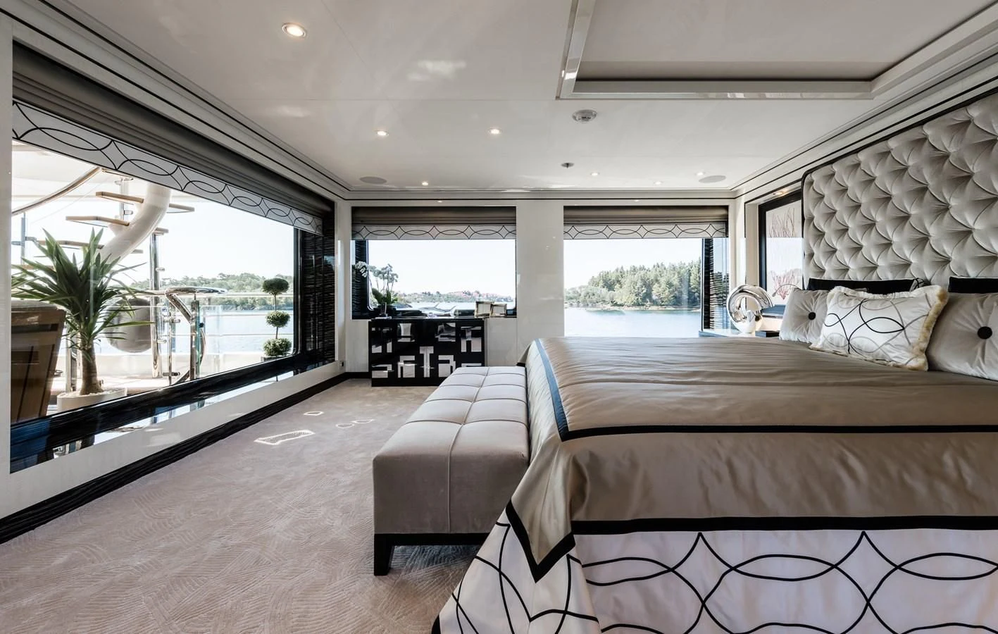 a large bedroom with a large window aboard AMIGOS Yacht for Charter