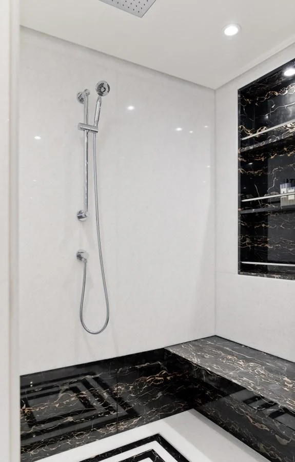 a shower head in a bathroom aboard AMIGOS Yacht for Charter