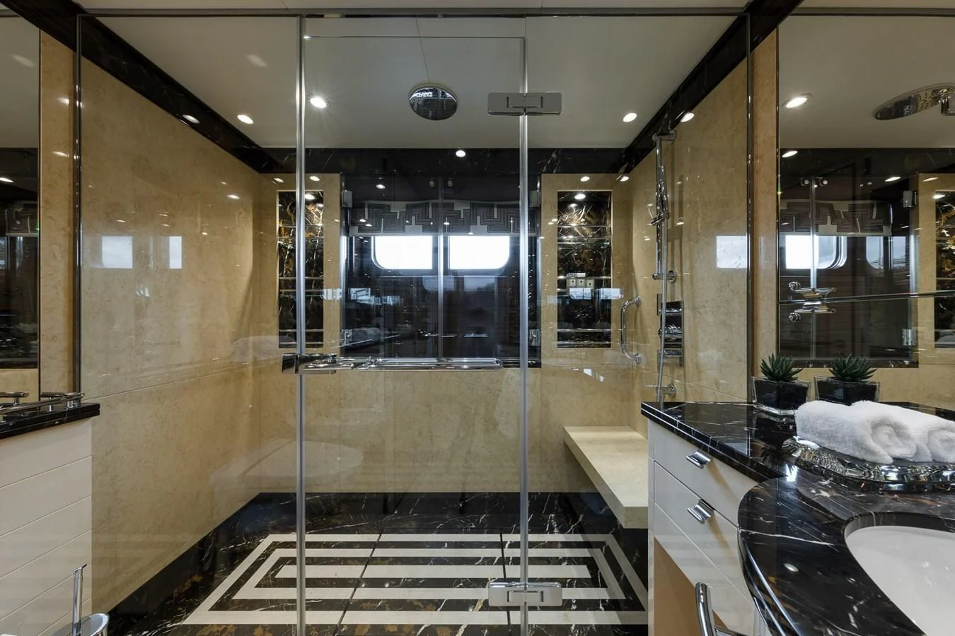 a bathroom with a glass shower aboard AMIGOS Yacht for Charter