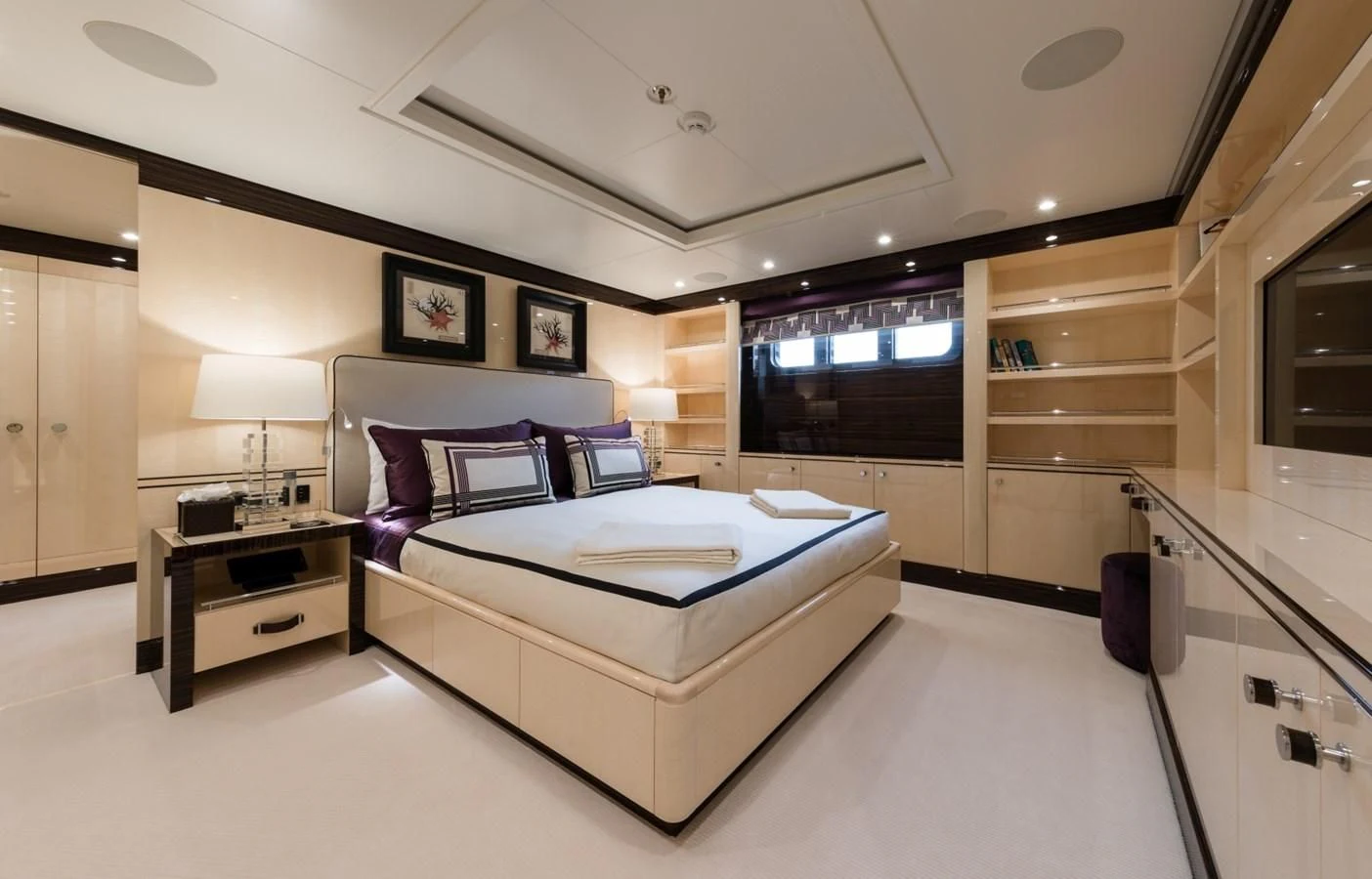a large bedroom with a large bed aboard AMIGOS Yacht for Charter