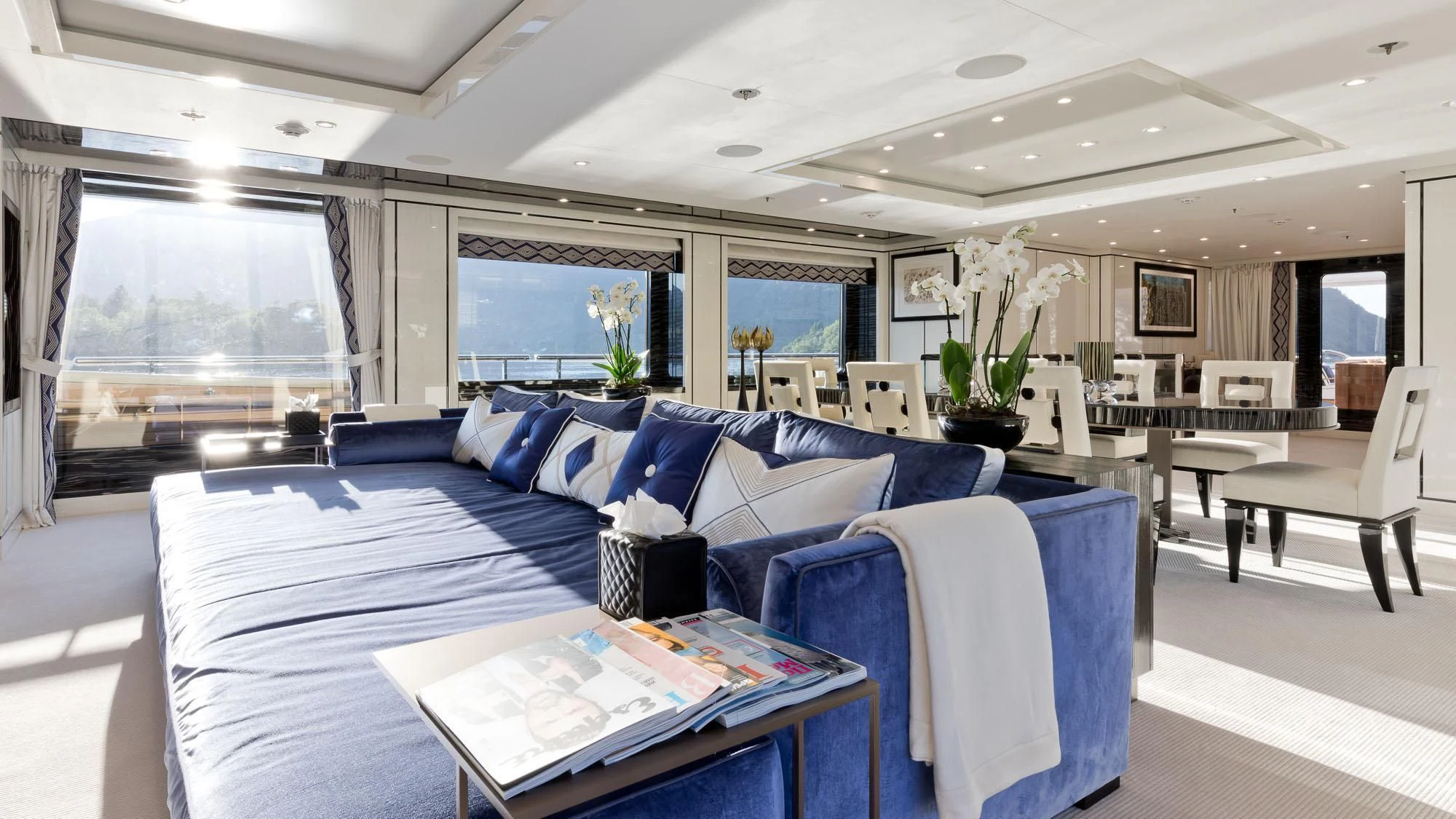 a living room with a large window aboard AMIGOS Yacht for Charter