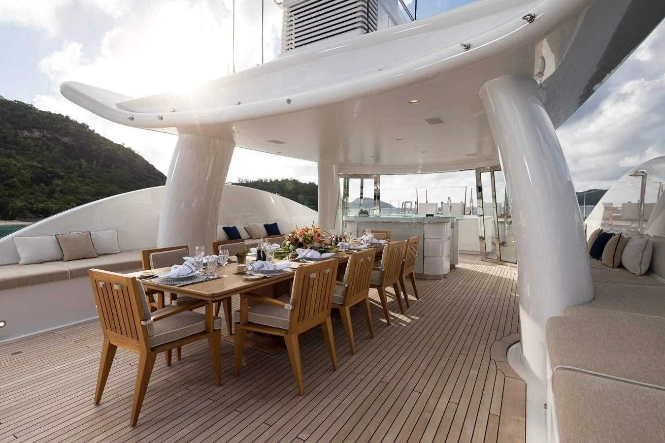 a room with a table and chairs aboard AMIGOS Yacht for Charter