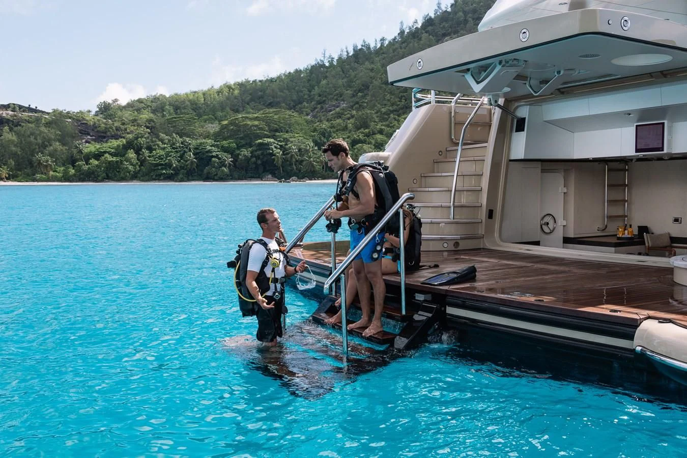 a group of people on a dock aboard AMIGOS Yacht for Charter