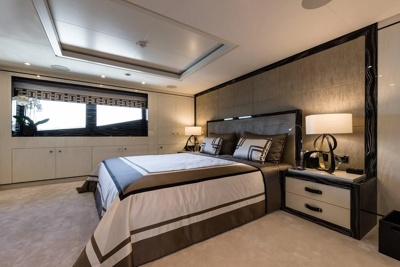 a bedroom with two beds aboard AMIGOS Yacht for Charter