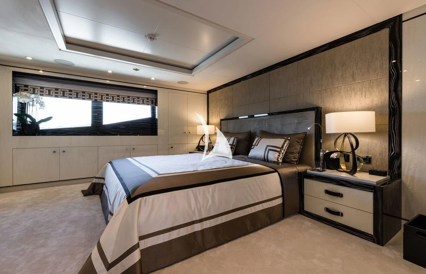 a bedroom with two beds aboard AMIGOS Yacht for Charter