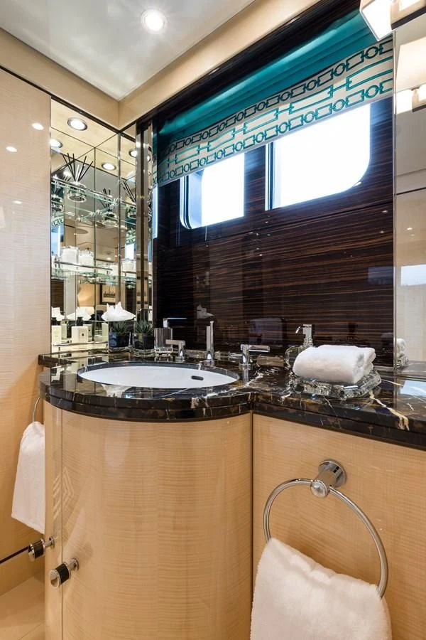 a bathroom with a large mirror aboard AMIGOS Yacht for Charter