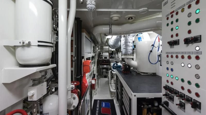 a room with white and black machinery aboard AMIGOS Yacht for Charter