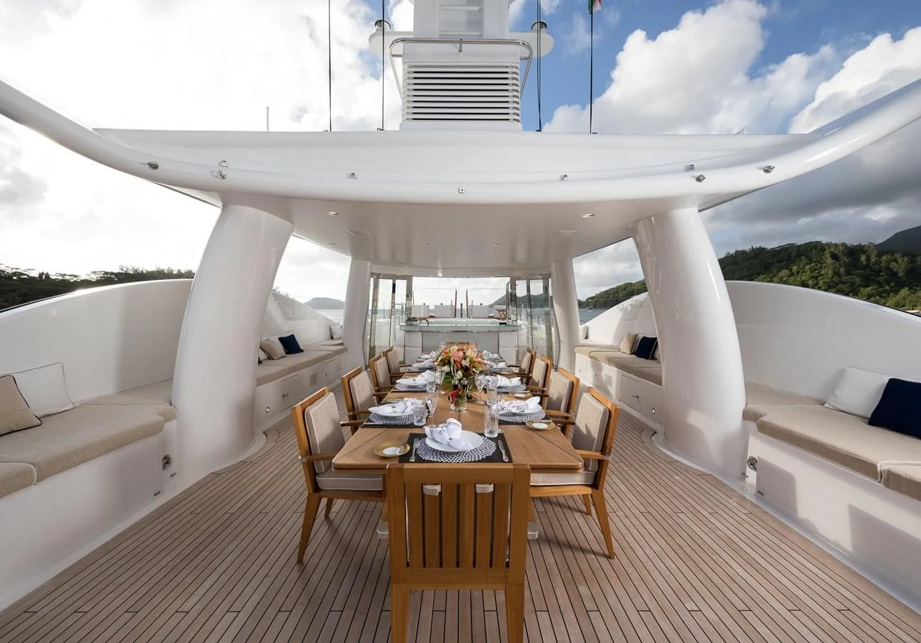 a room with a table and chairs aboard AMIGOS Yacht for Charter