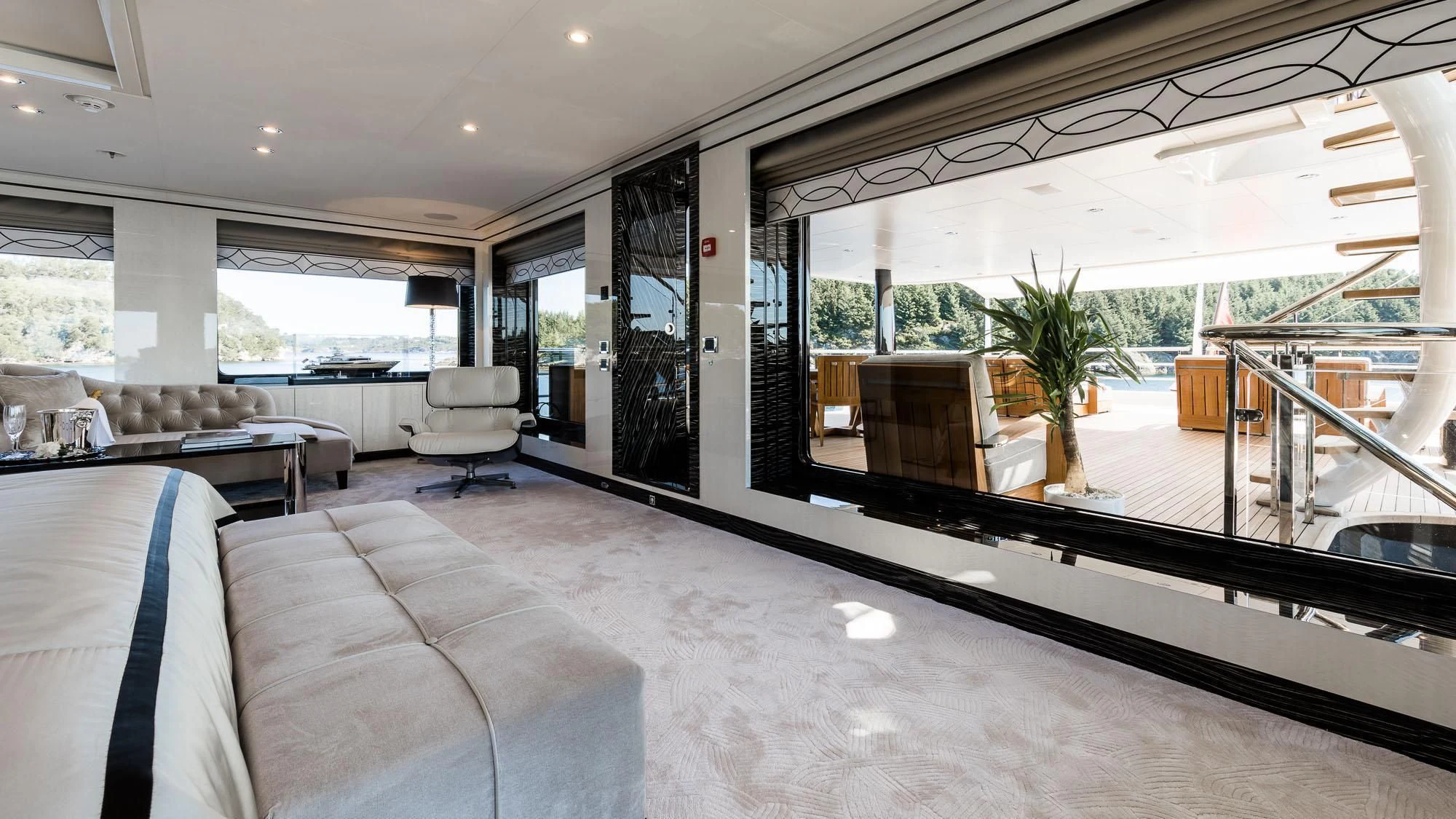 a large room with a couch and a table and chairs aboard AMIGOS Yacht for Charter