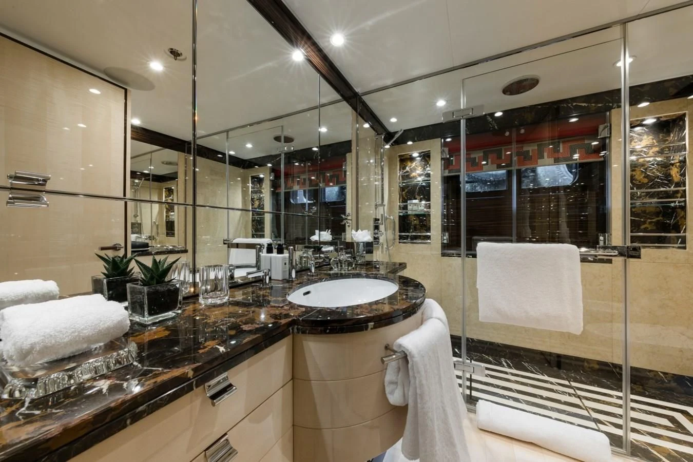 a bathroom with a large mirror aboard AMIGOS Yacht for Charter