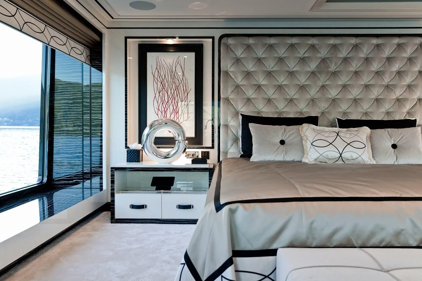a bedroom with a large mirror aboard AMIGOS Yacht for Charter