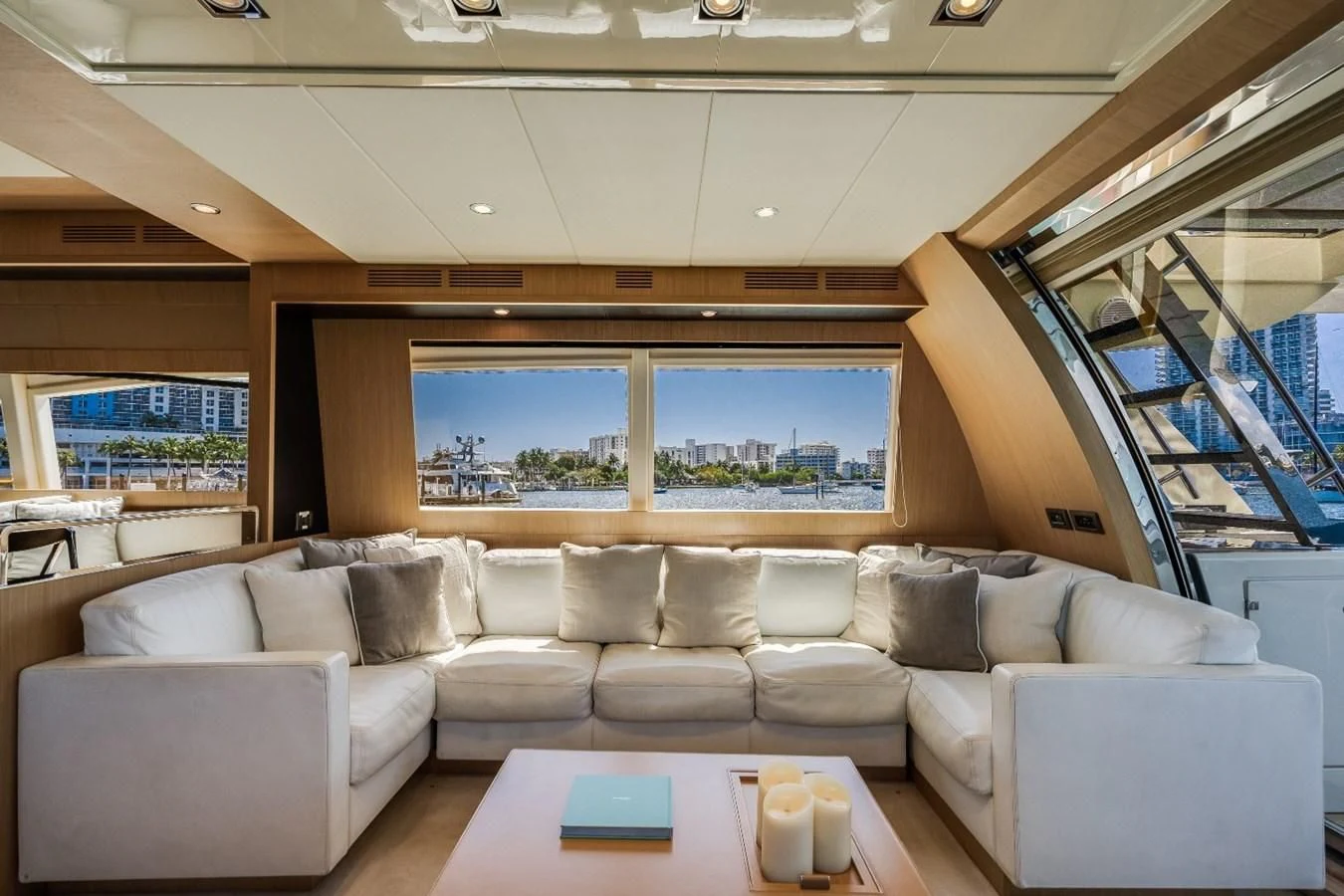a living room with a large window aboard NAMEDROPPER Yacht for Sale