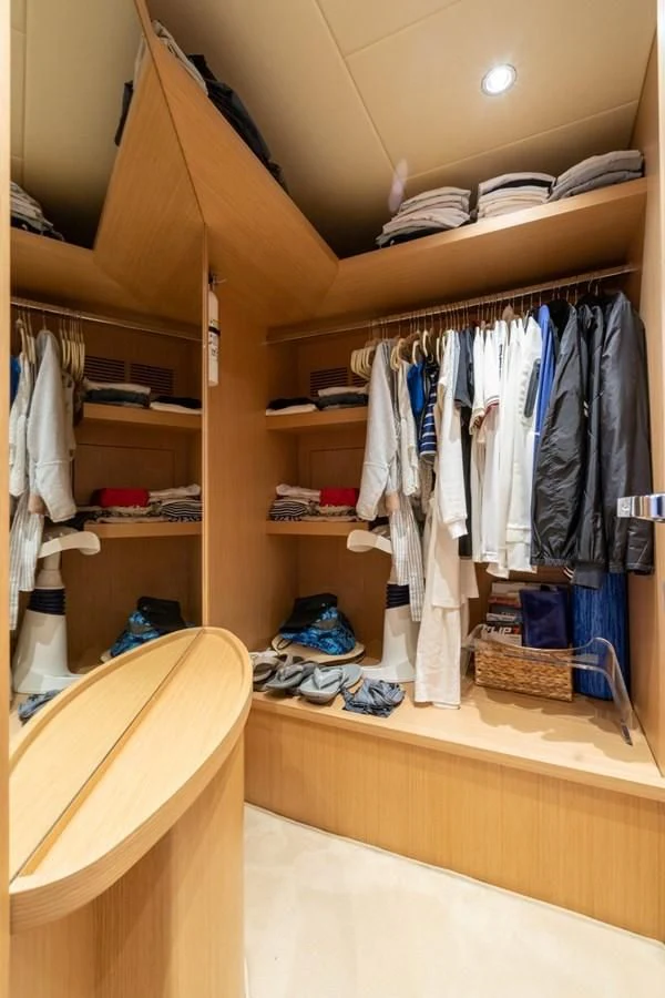 a closet full of clothes aboard NAMEDROPPER Yacht for Sale