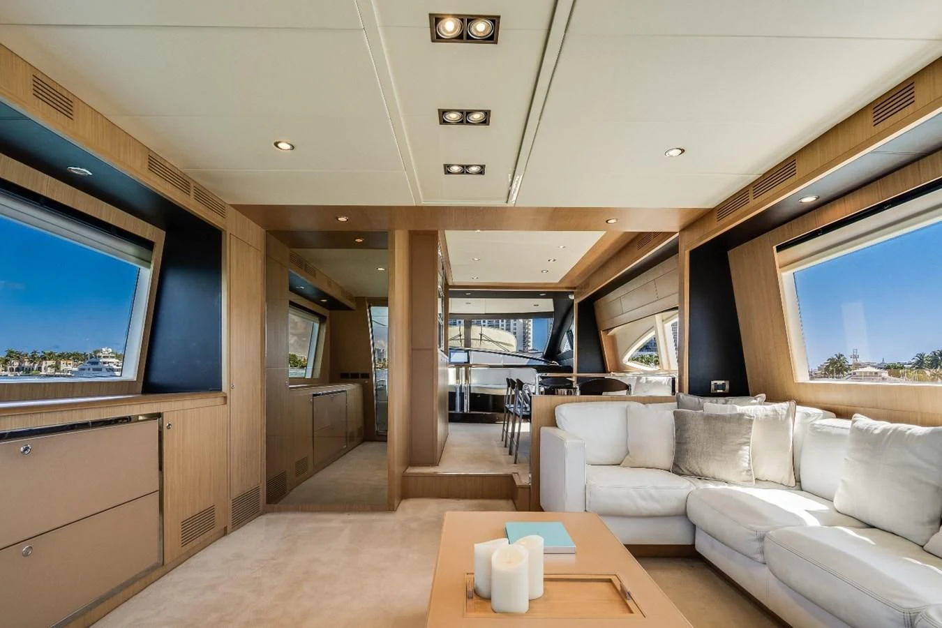 a living room with a large window aboard NAMEDROPPER Yacht for Sale
