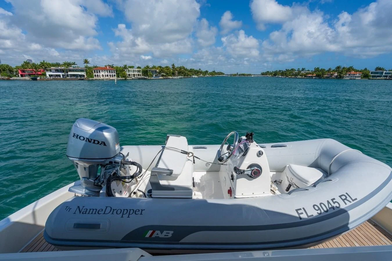 a motor boat on the water aboard NAMEDROPPER Yacht for Sale
