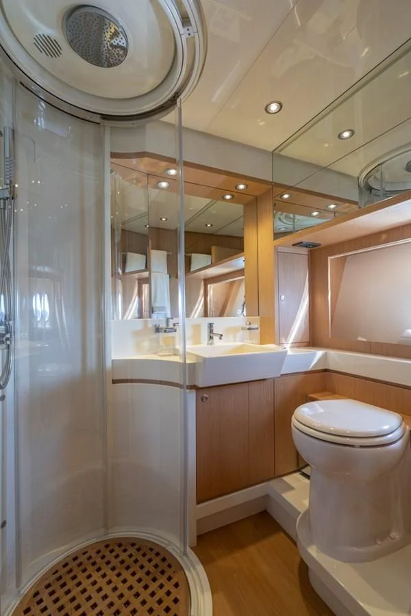 a bathroom with a shower unit and a toilet aboard NAMEDROPPER Yacht for Sale
