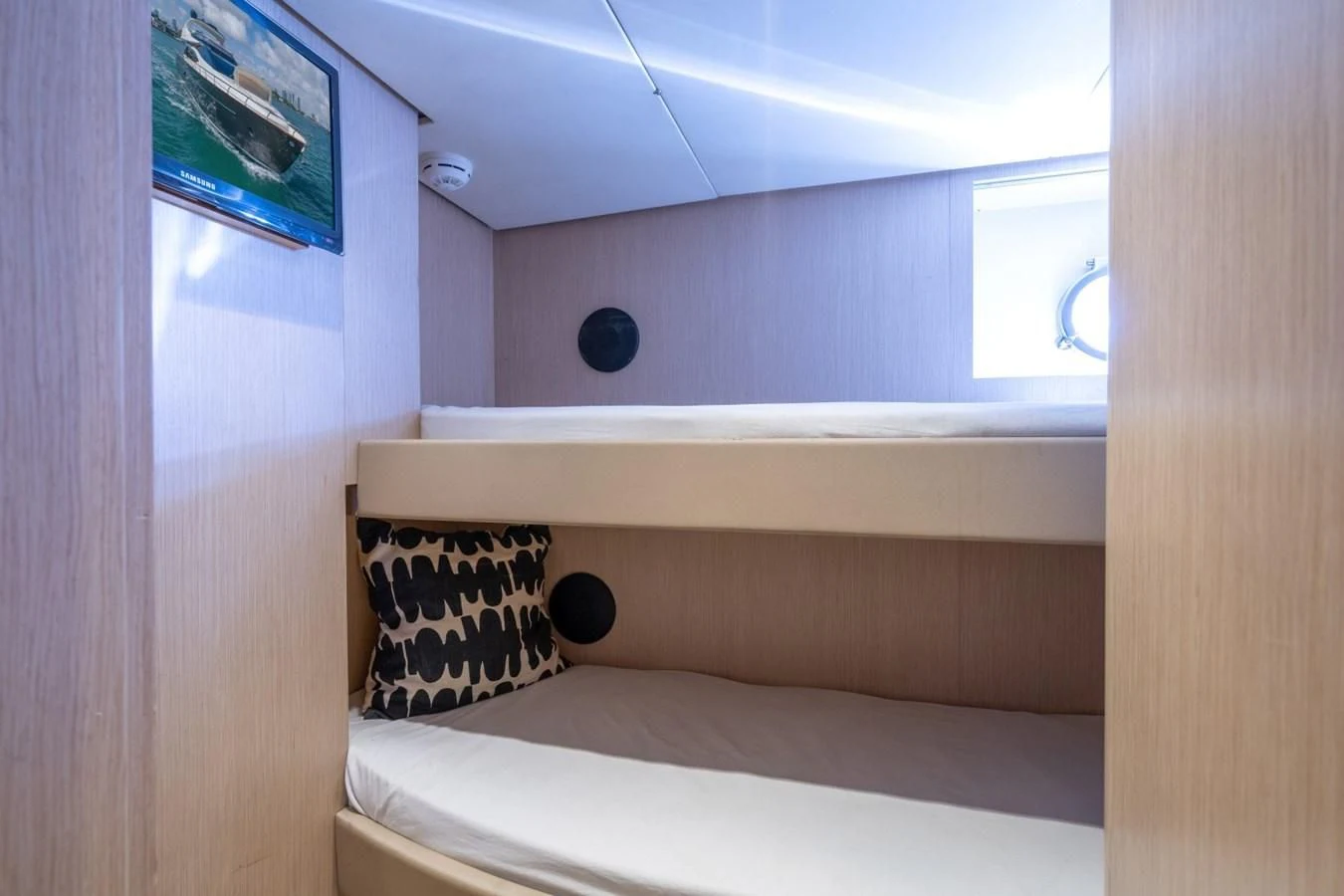 a bed with a pillow on it aboard NAMEDROPPER Yacht for Sale