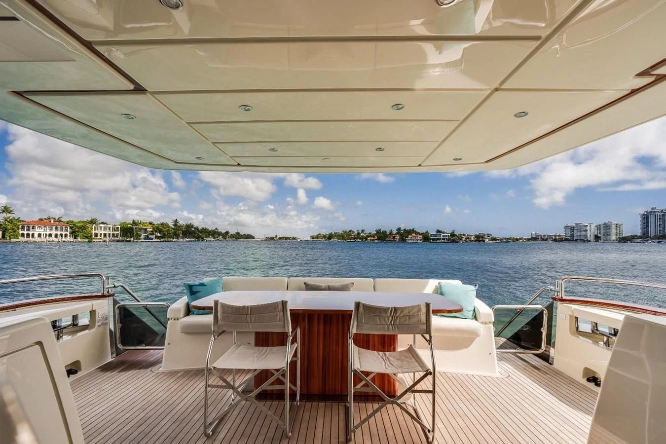 a large balcony overlooking a body of water aboard NAMEDROPPER Yacht for Sale