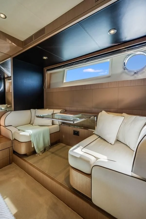 a room with a bed and a window aboard NAMEDROPPER Yacht for Sale