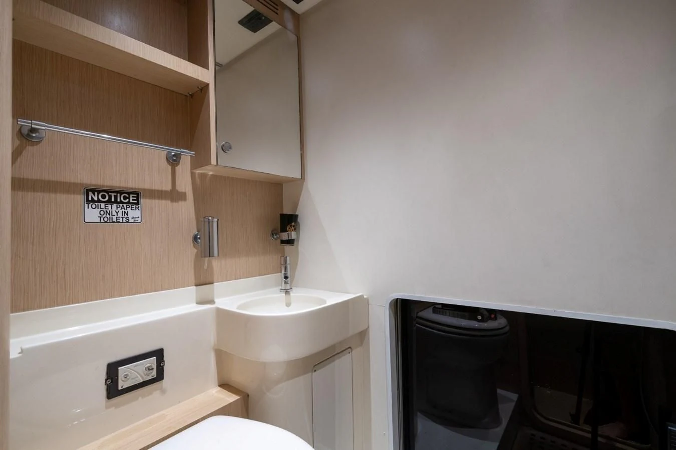 a bathroom with a sink and a toilet aboard NAMEDROPPER Yacht for Sale