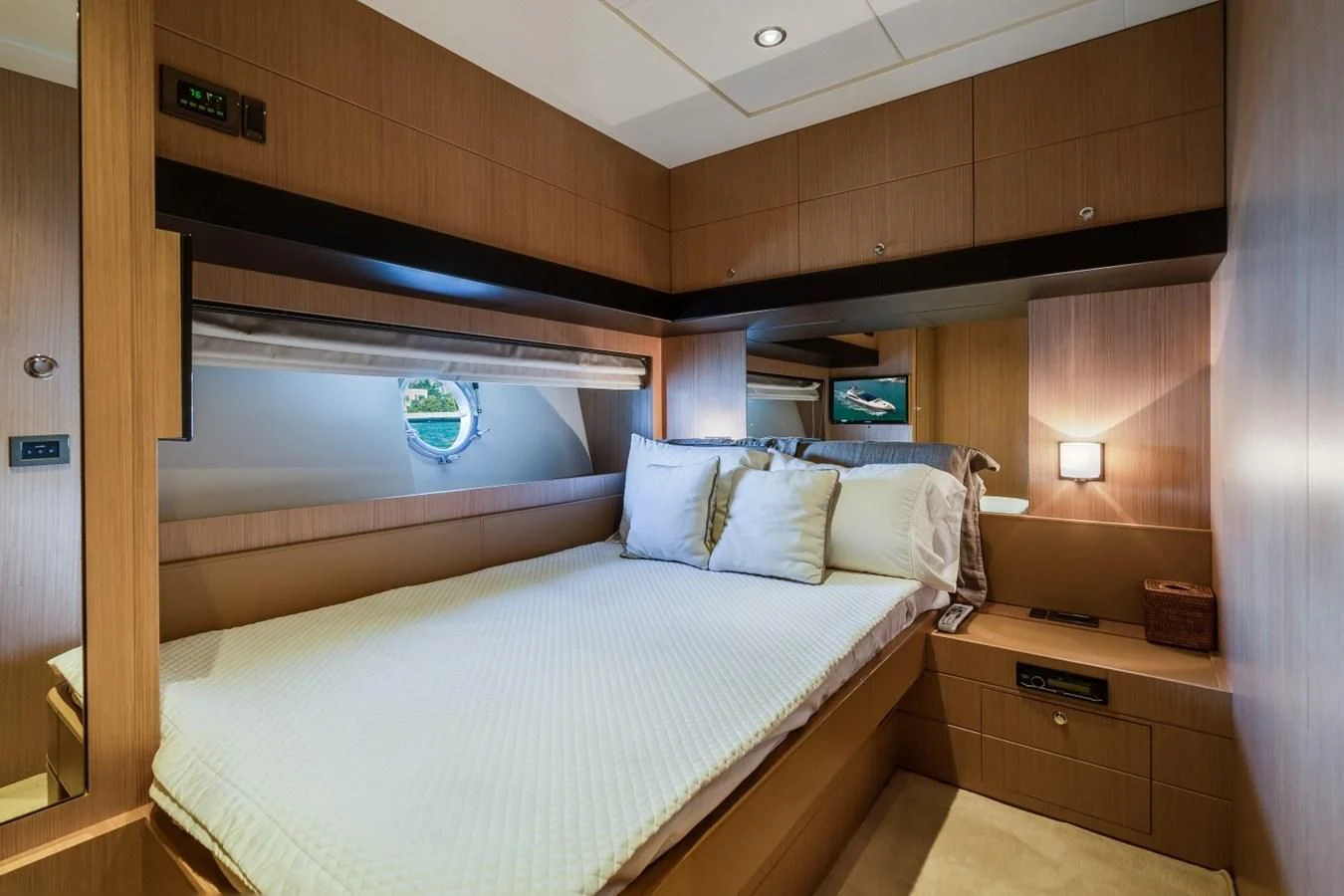 a room with a bed and a desk aboard NAMEDROPPER Yacht for Sale