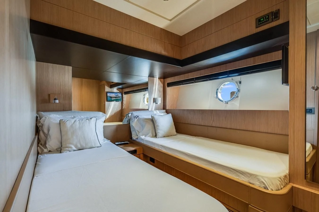 a room with two beds aboard NAMEDROPPER Yacht for Sale