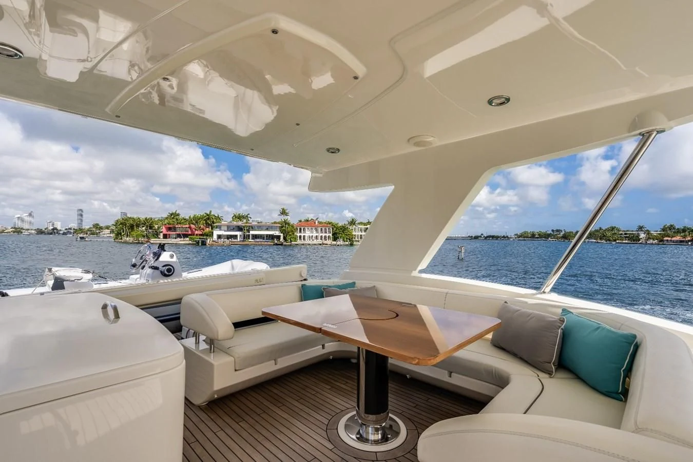a room with a table and chairs aboard NAMEDROPPER Yacht for Sale
