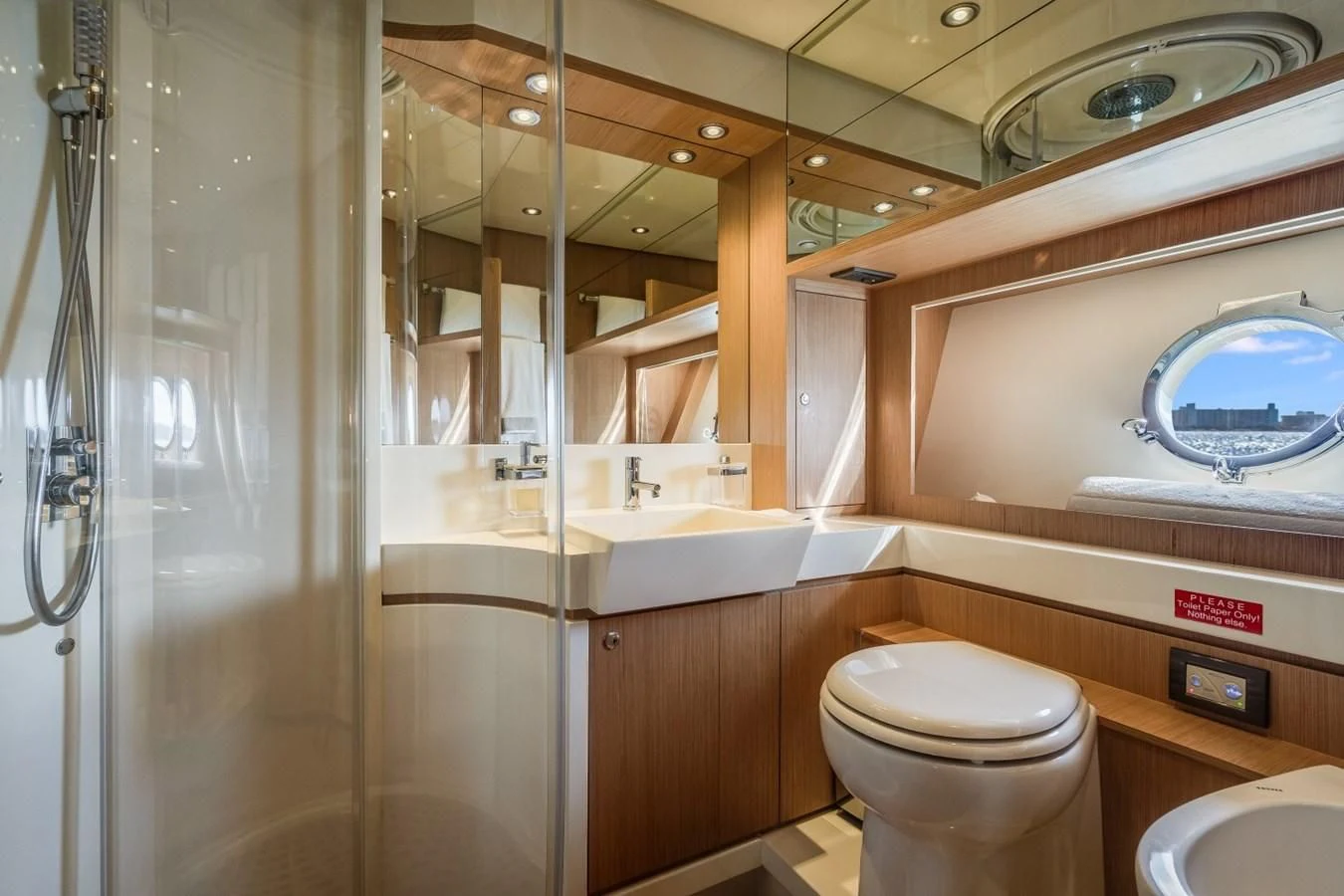 a bathroom with a glass shower aboard NAMEDROPPER Yacht for Sale