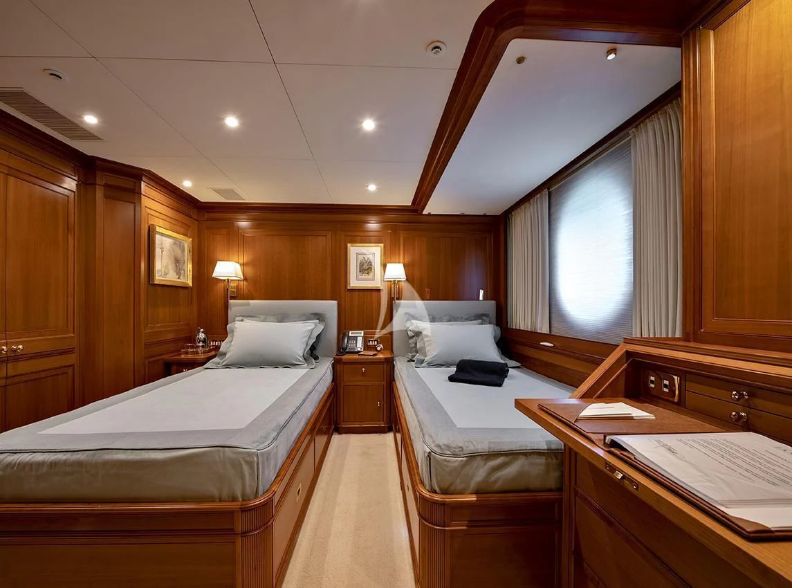 a room with a bed and a desk aboard JASALI II Yacht for Charter