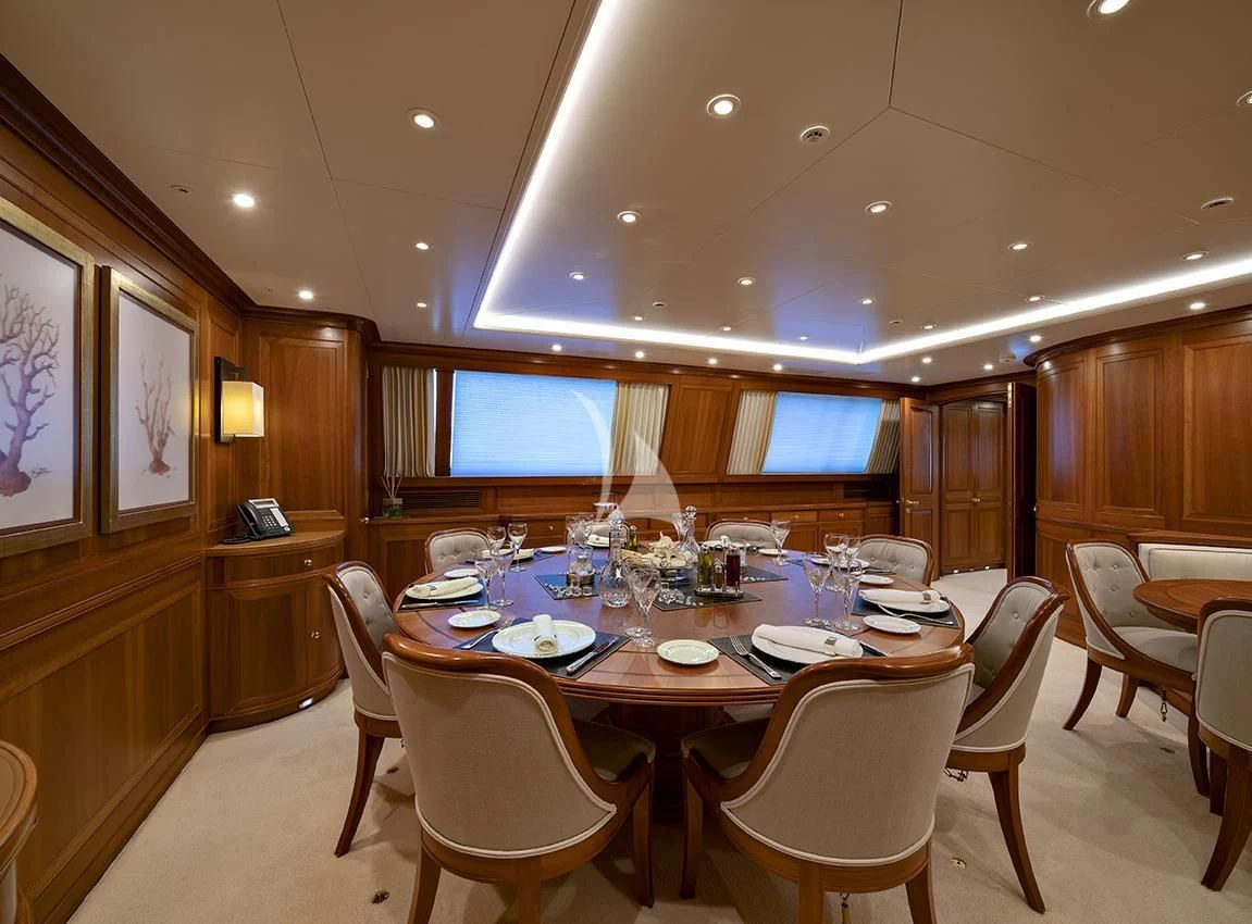 a restaurant with tables and chairs aboard JASALI II Yacht for Charter