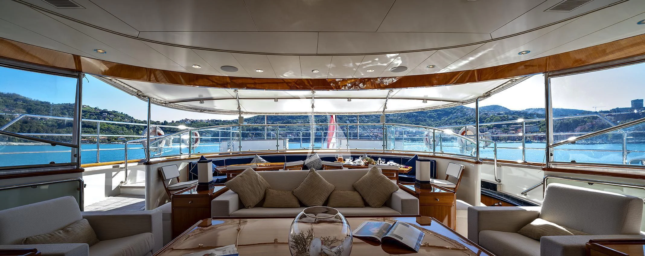 a room with a couch and a table and chairs aboard JASALI II Yacht for Charter