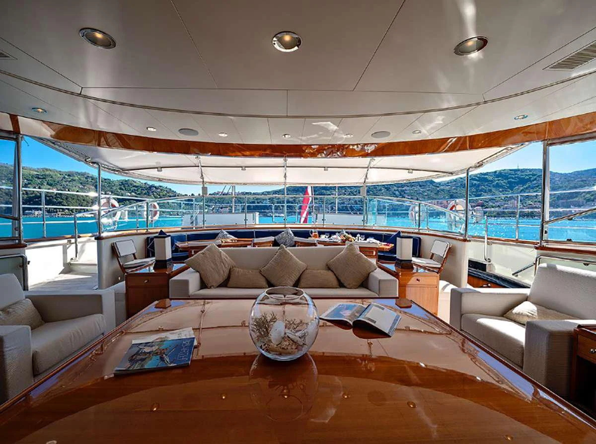 a living room with a large window aboard JASALI II Yacht for Charter