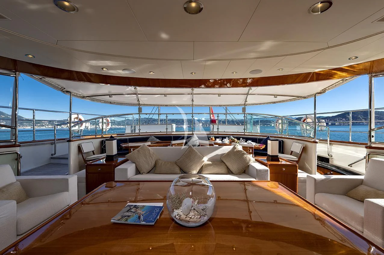 a living room with a large window aboard JASALI II Yacht for Charter