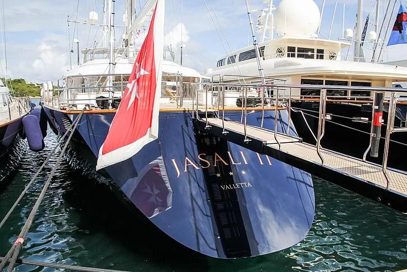 a boat with a flag on it aboard JASALI II Yacht for Charter