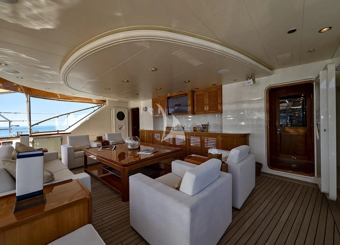 a large living room with a large window aboard JASALI II Yacht for Charter