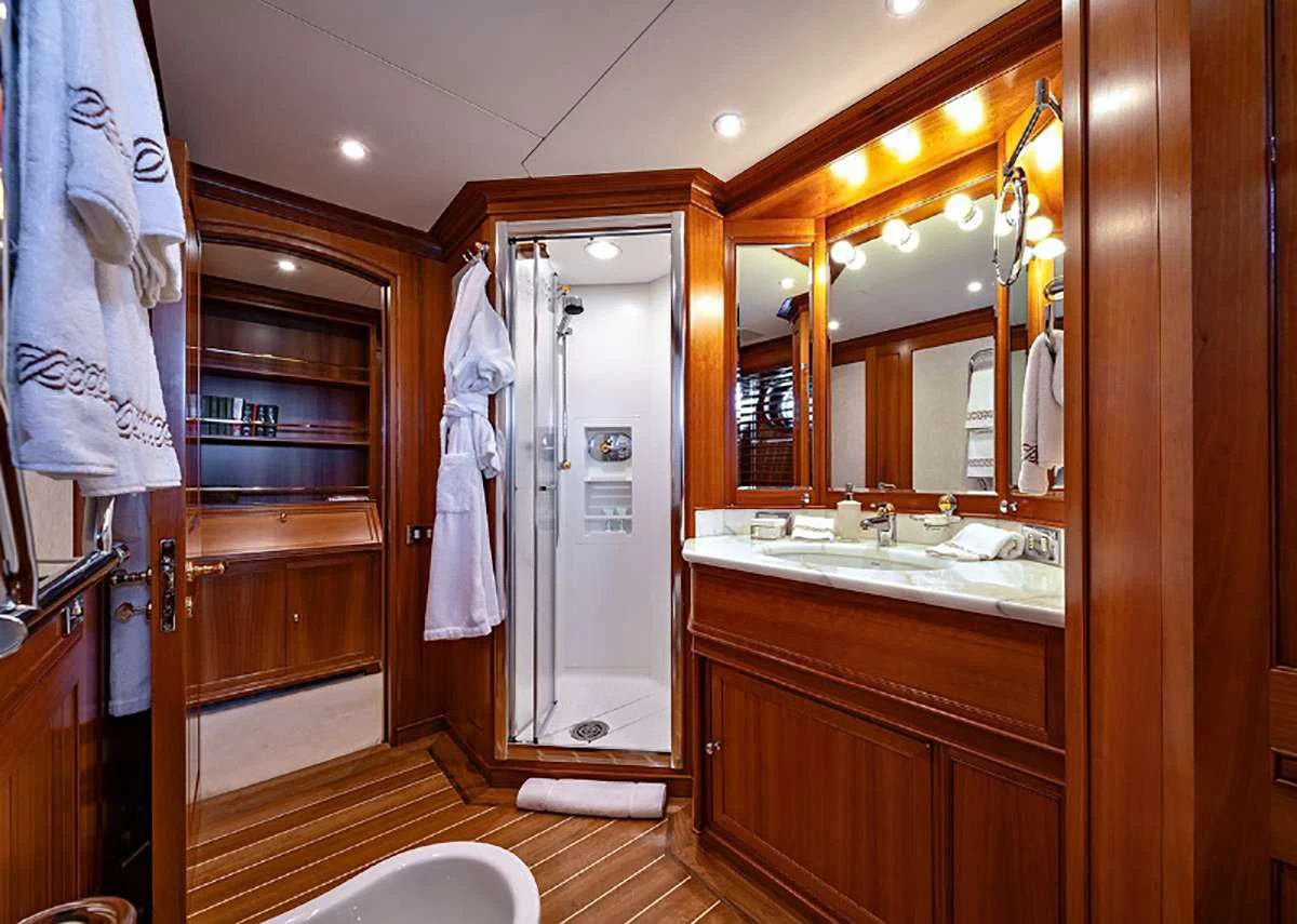 a bathroom with a large mirror aboard JASALI II Yacht for Charter