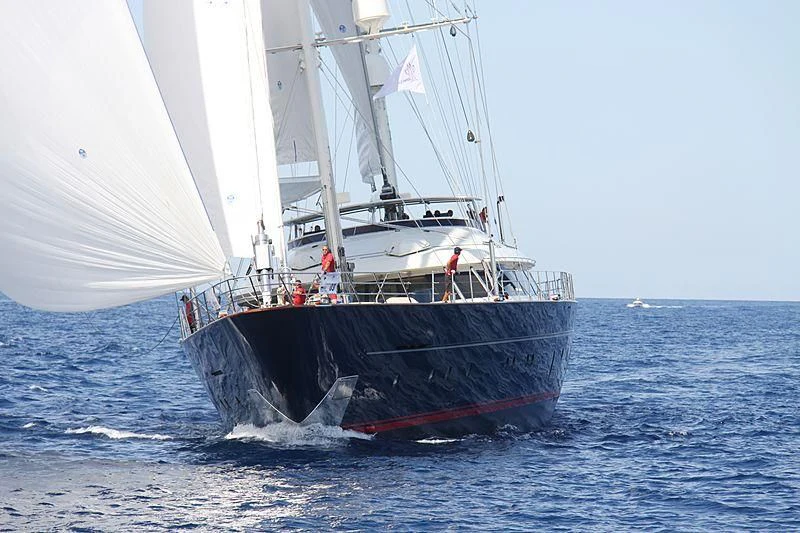 a boat with a flag on it aboard JASALI II Yacht for Charter